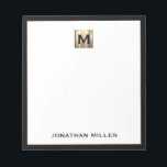 Personalized Gold Monogram Black White Notepad<br><div class="desc">Elevate your stationery game with this monogrammed notepad featuring classic block typography and a brushed gold medallion monogram and black trim. The notepad includes space for your name or custom text, making it perfect for personal or professional use. Use it to jot down notes, ideas, and reminders in style. It...</div>