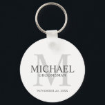 Personalized Groomsmen's name and monogram Keychain<br><div class="desc">Add a personal touch to your wedding with personalized groomsmen keychain. This keychain features personalized groomsman's name with title and wedding date in grey and monogram in light grey as background, in classic serif font style, on white background. Also perfect for best man, father of the bride, ring bearer and...</div>