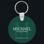 Personalized Groomsmen's name and monogram Keychain<br><div class="desc">Add a personal touch to your wedding with personalized groomsmen keychain. This keychain features personalized groomsman's name with title and wedding date in white and monogram in light emerald green as background, in classic serif font style, on emerald green background. Also perfect for best man, father of the bride, ring...</div>