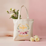 Personalized Happy Mother’s Day Floral Tote Bag<br><div class="desc">Celebrate Mom with this elegant Happy Mother’s Day floral tote bag featuring soft pink blossoms, delicate greenery, and beautiful golden accents arranged in a graceful wreath design. The warm, stylish lettering adds a cheerful and modern touch. Customize this tote with her name, a special message, or meaningful date to create...</div>