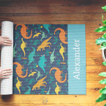 Personalized Kids Dinosaur Pattern Yoga Mat<br><div class="desc">Treat your littlest yogi to this cute dino themed yoga mat,  featuring a pattern of T Rex,  brontosaurus,  and more on a navy blue background. Personalize with a name or initials along the bottom.</div>