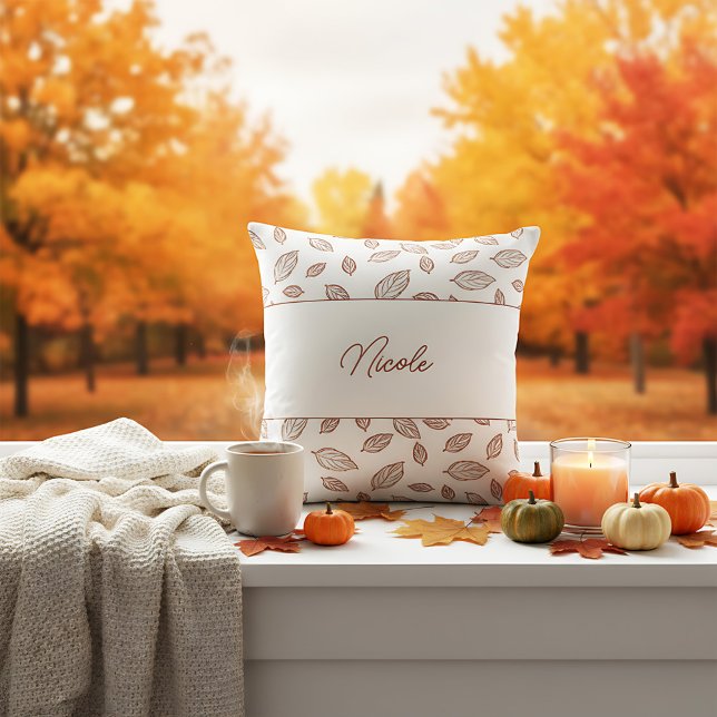 Personalized Minimalist Farmhouse        Leaf Fall Throw Pillow (A cozy farmhouse pillow with a fall theme, featuring a white background and scattered brown leaves.)