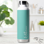 Personalized Minimalist Name Water Bottle<br><div class="desc">Simple yet stunning.  Personalize this water bottle with your name,  or a loved ones name.  A simple elegant script typography with a girly edge.  Change out the background and font colours to anything you want. Chic Trendy Simple Your Name Minimalist Water Bottle</div>