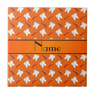 Personalized name orange brushes and tooth pattern tile