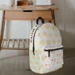 Personalized Pastel Sunshine Printed Backpack<br><div class="desc">This Kids School Backpack is a real dream come true for children, featuring subtle pastel shades of green, yellow, pink, and cream. The bag is adorned with sunshines, hearts, and rainbows, making it a cheerful and eye-catching addition to any school outfit. Not only is it aesthetically pleasing, but it's also...</div>