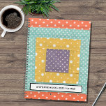 Personalized Patchwork 2023 Planner<br><div class="desc">This planner is decorated with a patchwork print in orange,  turquoise,  yellow,  and purple.
You can customize it by changing the photo to one of your own patchworks if you wish.
Change the name and year.
Use the Design Tool option to change the text size,  style,  or colour.</div>