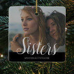 Personalized Photo Sisters Christmas tree Ceramic Ornament<br><div class="desc">A sisters photo christmas tree decoration can be changed to any relative. Featuring your favourite photograph,  the text 'Sisters' in a script font,  and their names over a black background.</div>