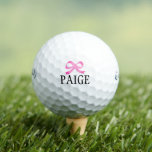 Personalized pink bow golf balls for women<br><div class="desc">Personalized pink bow golf balls for women. Customizable template with custom name or quote. Fun gift idea for golfers and golfing fans. Cute Birthday gift idea mom, wife, friends, team, group, teacher, top instructor, bride, bridesmaids, caddie, marshal, sister, daughter, kids etc. White or custom background colour. Example name: Paige. Available...</div>