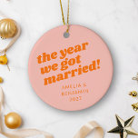 Personalized Pink Orange First Christmas Married Ceramic Ornament<br><div class="desc">Celebrate your first Christmas as a married couple with this stunning personalized ornament featuring bold retro typography in pastel pink and orange hues. This ceramic ornament brings a playful yet stylish touch to your holiday decor, perfectly capturing the joy of your first holiday season together. The eye-catching design and personalized...</div>