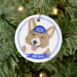 Personalized Red and White Corgi Dog Hanukkah Ceramic Ornament<br><div class="desc">Celebrate your favourite mensch on a bench with personalized ornament! This design features a sweet illustration of a red and white corgi dog with a blue and white yarmulke. For the most thoughtful gifts, pair it with another item from my collection! To see more work and learn about this artist,...</div>