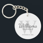 Personalized Script Groomsmen's name and Monogram  Keychain<br><div class="desc">Add a personal touch to your wedding with personalized groomsmen keychain. This keychain features personalized groomsman's name in grey classic script font style with wedding details in grey classic serif font style and monogram in light grey classic serif font style as background, on white background. Also perfect for best man,...</div>