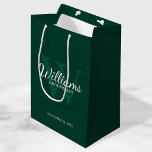 Personalized Script Groomsmen's name and Monogram  Medium Gift Bag<br><div class="desc">Add a personal touch to your wedding with personalized groomsmen gift bag. This gift bag features personalized groomsman's name in white classic script font style with wedding details in white classic serif font style and monogram in light emerald green classic serif font style as background, on emerald green background. Also...</div>