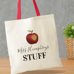 Personalized Teacher Gift Tote Bag<br><div class="desc">Show your teacher how much you appreciate them with our unique, personalized tote bag! This stylish bag features your teacher's name, a whimsically carved apple with a heart out, and a heartfelt 'Thank You.' A gift that combines practicality, personal touch and a whole lot of gratitude all in one. Let's...</div>