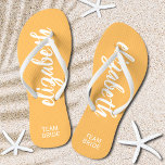 Personalized Team Bride Orange and White Flip Flops<br><div class="desc">Light orange and white - or any colour - flip flops personalized with your name and "Team Bride" or any wording you choose. Great bridesmaid gift, bachelorette party, flat shoes for the wedding reception, or a fun bridal shower favour. Change the colour straps and footbed, too! More colours done for...</div>