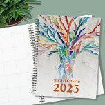 Personalized Tree of Life  2023 Planner<br><div class="desc">This unique Planner is decorated with a brightly coloured Tree of Life on a pale grey background. The original design was made in mosaic using tiny pieces of brightly coloured glass. Customize it with your name and year. To edit further use the Design Tool to change the font, font size,...</div>