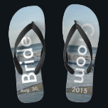 Personalized Wedding Beach Sand Flip Flops<br><div class="desc">Pretty Blue Sky with Light Fluffy White Clouds, Blue Sea, Crashing Ocean Waves and Beach Sand. Unisex Flip Flops with Bride and Groom Date of Marriage written in a white colour text. PERSONALIZE with your text on left and right feet, (or delete text to only show image). The wedding date...</div>