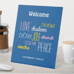 Personalized WELCOME LOVE JOY PEACE Jewish Pedestal Sign<br><div class="desc">Give your home a welcoming edge with this personalized Hebrew Welcome Pedestal Sign in tekhelet blue with CUSTOMIZABLE TEXT. The placeholder text is customizable, so you can change the heading and add your family name. The words LOVE JOY PEACE are also written in Hebrew (and colour coded). Suitable for Hanukkah,...</div>