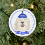 Personalized White Cream Doodle Dog Hanukkah Ceramic Ornament<br><div class="desc">Celebrate your favourite mensch on a bench with personalized ornament! This design features a sweet illustration of a white or cream doodle dog with a blue and white yarmulke. For the most thoughtful gifts, pair it with another item from my collection! To see more work and learn about this artist,...</div>