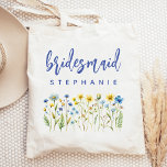 Personalized Wildflowers Blue Script Bridesmaid Tote Bag<br><div class="desc">This simple,  elegant tote bag features a border of wildflowers in shades of yellow and blue with green stems. The word "bridesmaid" appears in blue handwriting script. Personalize it with her name in sans serif font. Makes a perfect bridesmaid gift!</div>