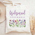 Personalized Wildflowers Purple Script Bridesmaid Tote Bag<br><div class="desc">This simple,  elegant tote bag features a border of wildflowers in shades of purple and pink with green stems. The word "bridesmaid" appears in purple handwriting script. Personalize it with her name in sans serif font. Makes a perfect bridesmaid gift!</div>