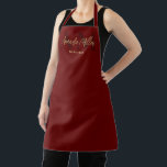 Personalized With Name Red Gold Modern Monogram Apron<br><div class="desc">Introducing our Professional Dark Red Gold Modern Custom Minimal Apron – the perfect blend of elegance and functionality, making it an ideal gift for any occasion, especially for the wonderful women in your life. This personalized apron is adorned with an elegant script typography and a modern minimalist script monogram, creating...</div>