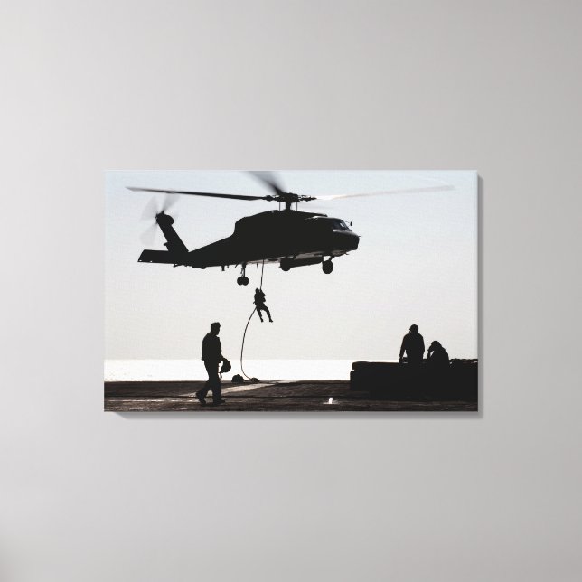Personnel fast-rope out of an SH-60F Canvas Print (Front)