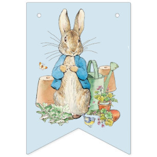Peter the rabbit in his garden bunting flags