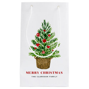 Petit Sac Cadeau Arbre de Noël sur un panier en osier Joyeux Noël