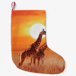 Petite Chaussette De Noël Girafe dans la savane africaine contre le dos