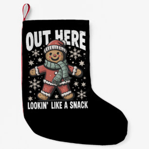 Petite Chaussette De Noël Ici dehors ayant l'air d'un en-cas pain d'épice de