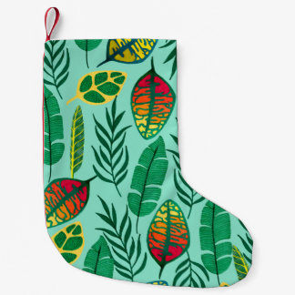 Petite Chaussette De Noël Motif sans couture avec feuilles tropicaux. L'art 