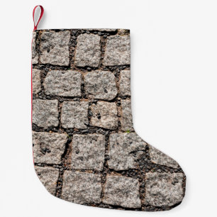 Petite Chaussette De Noël Vieux motif en pierre de caillou dans la rue abstr