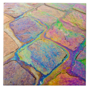 Petrol on cobblestones tile