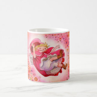 Peu de joies simples de tasse rouge de capuchon