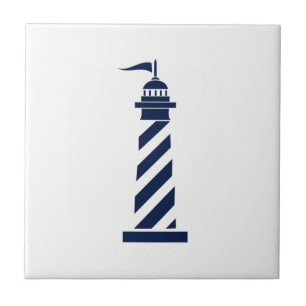 Phare bleu sur le carreau de céramique blanc
