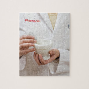 Pharmacist holding mortar and pestle jigsaw puzzle