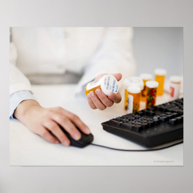 Pharmacist with pill bottles at computer poster (Front)