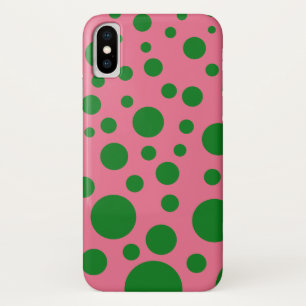 Phone case with green circles on a pink background