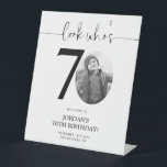 Photo 70th Birthday Welcome Sign | Look Who's 70<br><div class="desc">Welcome guests to your 70th birthday celebration with this stunning editable welcome sign. Featuring a sleek, customizable layout, this template allows you to easily add your own photo and personalize the text, making it a perfect addition to your milestone 70th birthday decor. Ideal for entryways or as a party focal...</div>