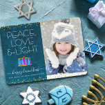 Photo Blue Hanukkah Menorah Peace Love Light Type Holiday Card<br><div class="desc">“Peace, love & light.” A playful, modern, artsy illustration of boho pattern candles in a menorah helps you usher in the holiday of Hanukkah, along with the custom photo of your choice. Assorted blue candles with colourful faux foil patterns overlay a rich, deep teal blue marble watercolor background. Faux gold...</div>