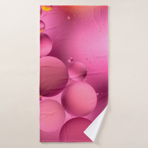 photo, bright oily drops in water with colourful b bath towel