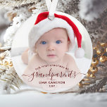 Photo Grandparents First Christmas Red Script Ornament<br><div class="desc">Help them celebrate their first grandchild with this beautiful modern keepsake ornament. The burgundy red text reads "Our first Christmas as grandparents, " with the word "grandparents" in elegant handwriting script with flourishes before and after. Easily replace the sample image with your favourite photo of the new baby, and add...</div>