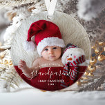 Photo Grandparents First Christmas White Script Ornament<br><div class="desc">Help them celebrate their first grandchild with this beautiful modern keepsake ornament. The white text reads "Our first Christmas as grandparents, " with the word "grandparents" in elegant handwriting script with flourishes before and after. Easily replace the sample image with your favourite photo of the new baby, and add his...</div>