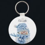 Photo of a Cute Snowman in Winter - Christmas Keychain<br><div class="desc">A key chain with a cute photograph of a little snowman. Standing outside in the winter with snow falling all around. This cute little guy is dressed up in blue knitted hat and scarf.</div>