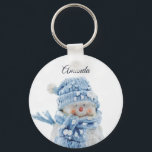 Photo of a Cute Snowman in Winter - Christmas Keychain<br><div class="desc">A key chain with a cute photograph of a little snowman. Standing outside in the winter with snow falling all around. This cute little guy is dressed up in blue knitted hat and scarf.</div>