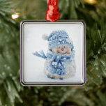 Photo of a Cute Snowman in Winter - Christmas Metal Ornament<br><div class="desc">An ornament with a cute photograph of a little snowman. Standing outside in the winter with snow falling all around. This cute little guy is dressed up in blue knitted hat and scarf.</div>