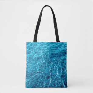 Photo of a macro bubbling blue clear sea water tote bag