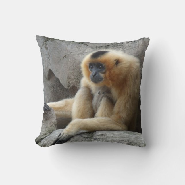 Photo of Orange and Black Gibbon Relaxing on Cliff Throw Pillow (Front)