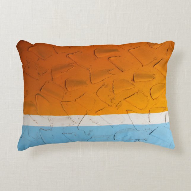Photo of orange, white, and blue artwork accent pillow (Front)