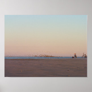 Photograph of two bicycles at the beach. poster